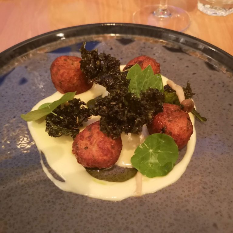 Potato and parsley dumplings, taleggio, crispy kale